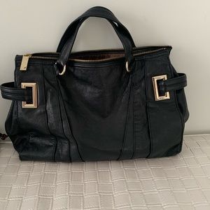 Black Botkier handbag with handles and gold hardware.12x7. soft leather